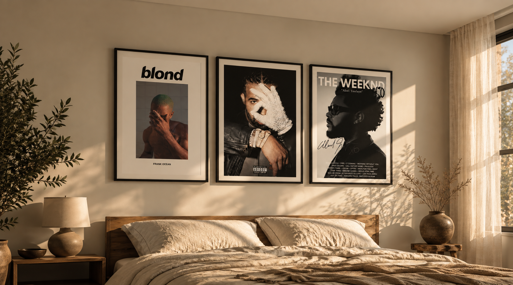 Three framed music prints above a sunlit bed